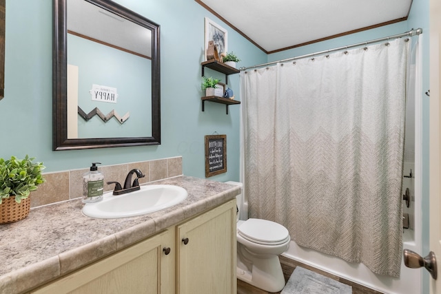 full bathroom with hardwood / wood-style floors, vanity, shower / tub combo, toilet, and crown molding