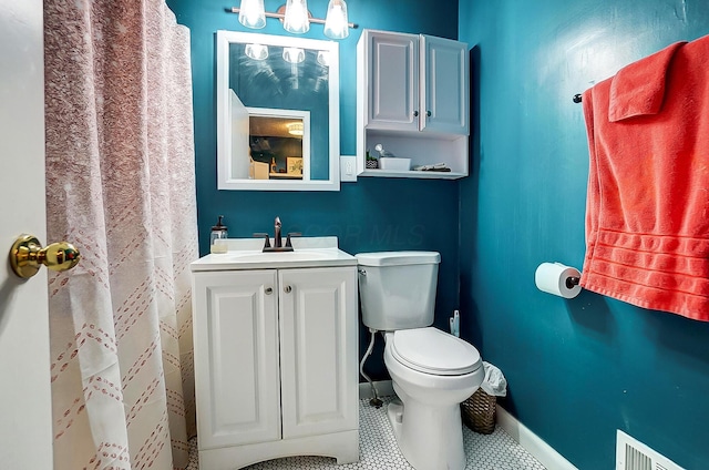 bathroom featuring vanity and toilet