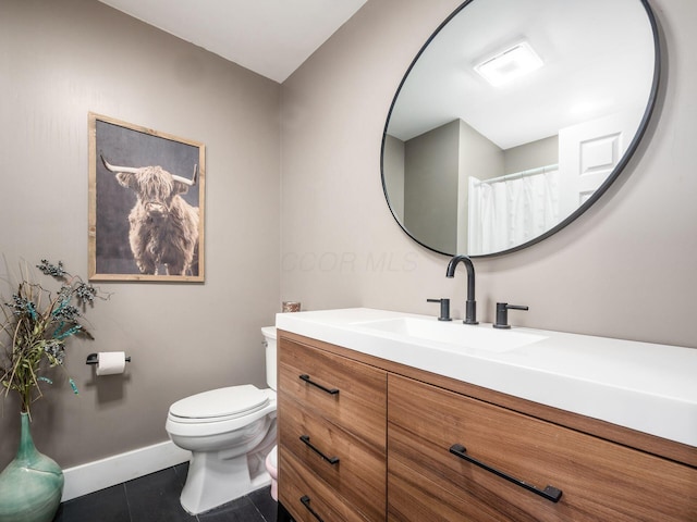 full bath with baseboards, vanity, toilet, and tile patterned floors