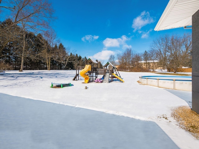 snow covered playground with a playground