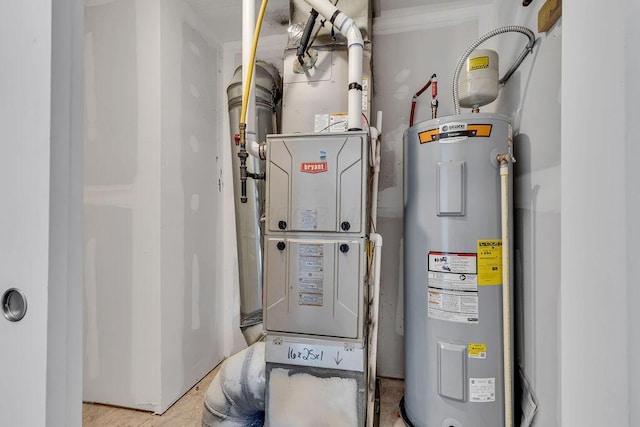 utility room featuring water heater