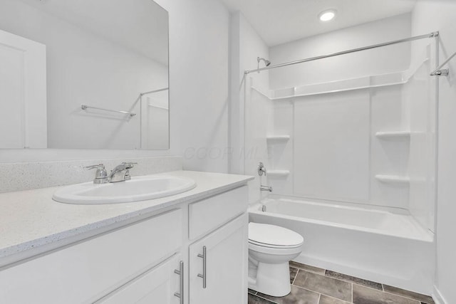 full bath with toilet, vanity, and shower / washtub combination