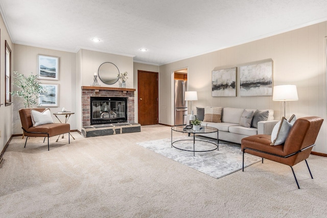 carpeted living area featuring crown molding, a fireplace, baseboards, and a textured ceiling