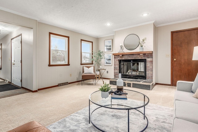 carpeted living room with visible vents, crown molding, baseboards, a fireplace, and a textured ceiling