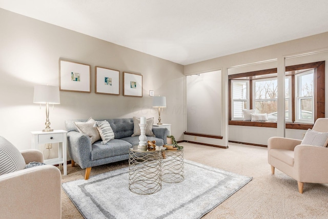 living area with baseboards and carpet flooring