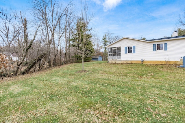 view of yard featuring a sunroom