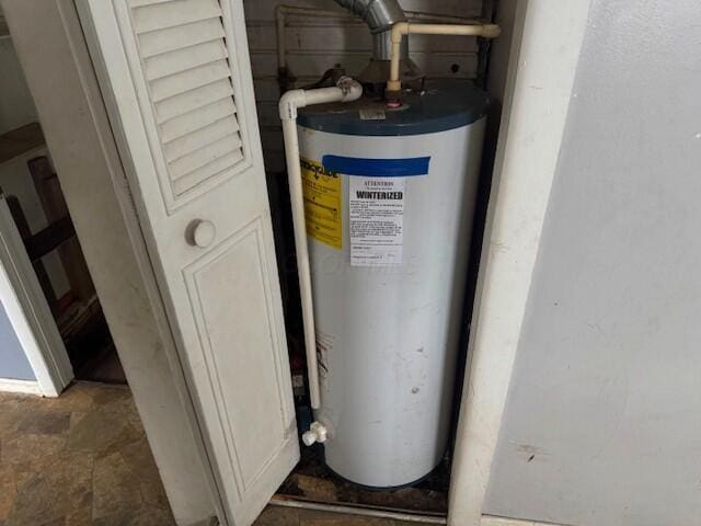 utility room with water heater