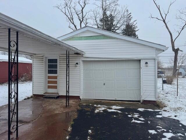 view of snow covered garage