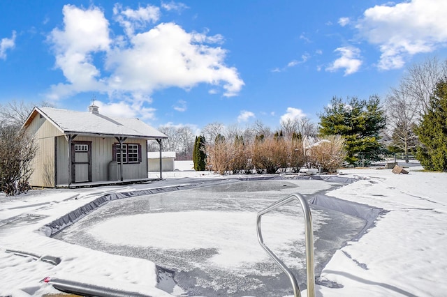 snowy yard with an outdoor structure