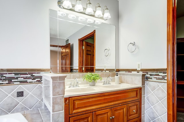 bathroom featuring tile walls and vanity