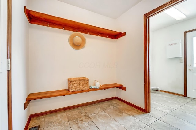 mudroom featuring light tile patterned floors