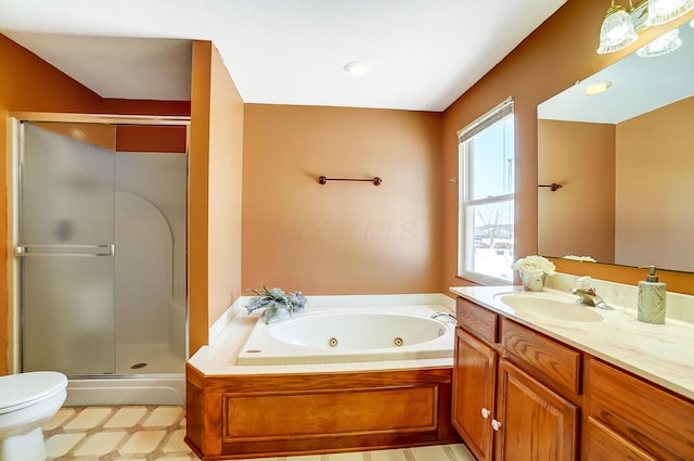 full bathroom featuring toilet, independent shower and bath, and vanity