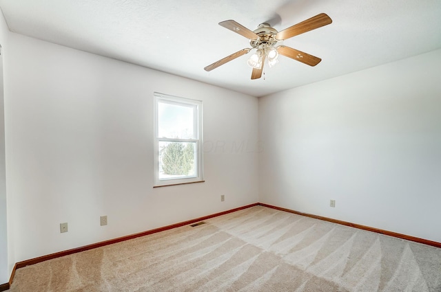 carpeted empty room with ceiling fan