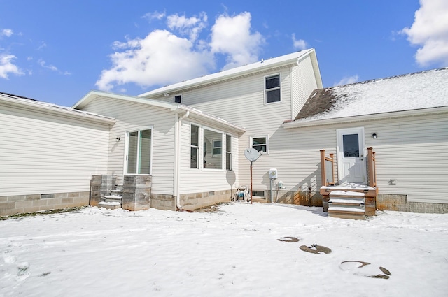 view of snow covered house