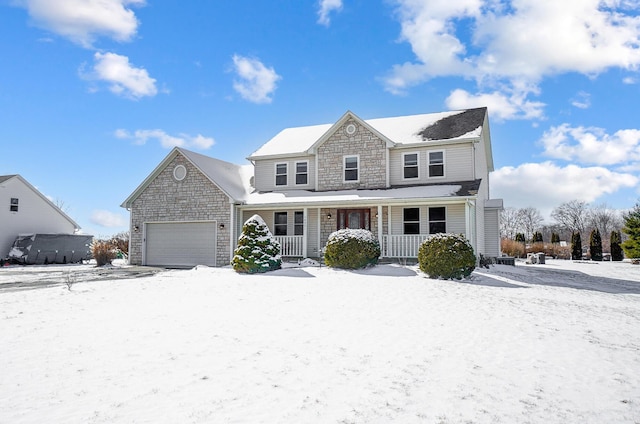 view of front of home with covered porch and a garage