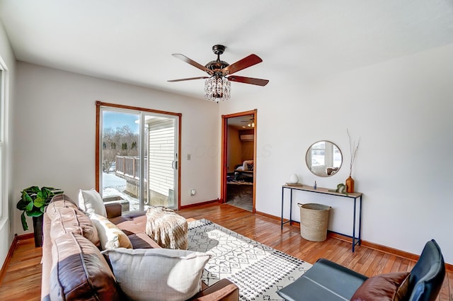 living room with ceiling fan and wood-type flooring