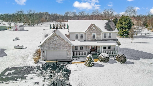 view of front of property with a garage and a porch