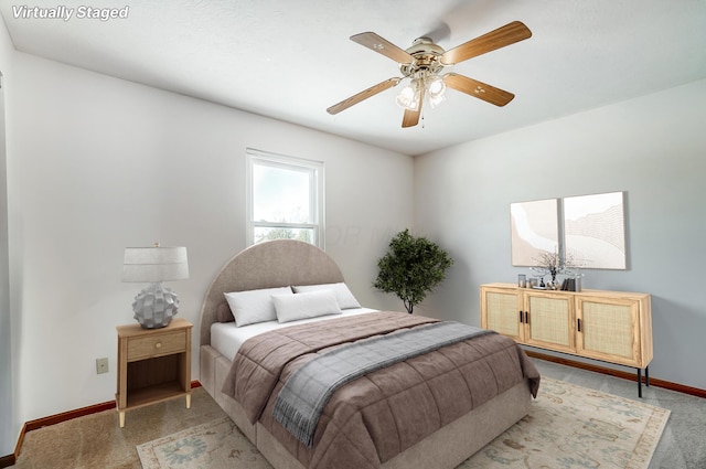 carpeted bedroom with ceiling fan