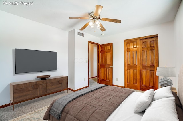 carpeted bedroom with ceiling fan