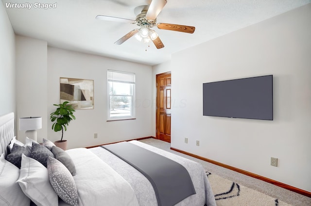 carpeted bedroom with ceiling fan