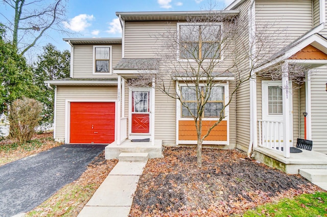 multi unit property featuring a garage