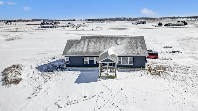 snowy aerial view with a rural view