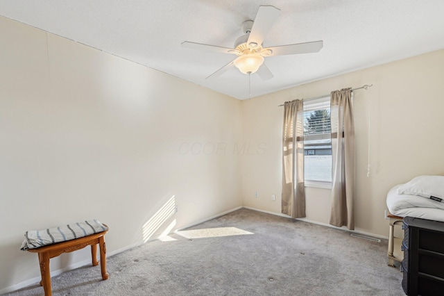 carpeted empty room with ceiling fan