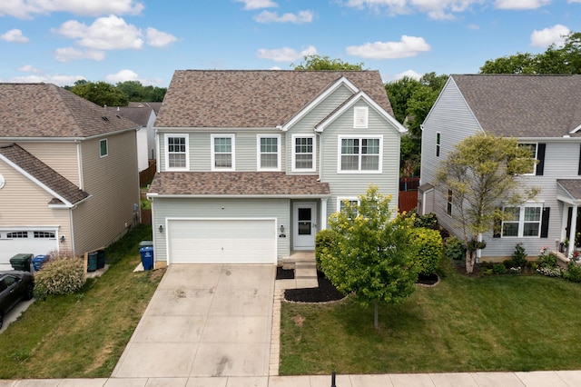 view of front of home with a garage and a front yard