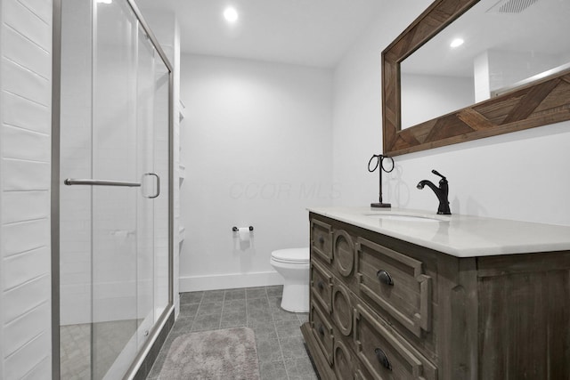 bathroom featuring walk in shower, vanity, and toilet