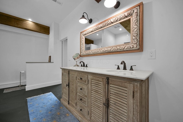 bathroom featuring vanity and beam ceiling