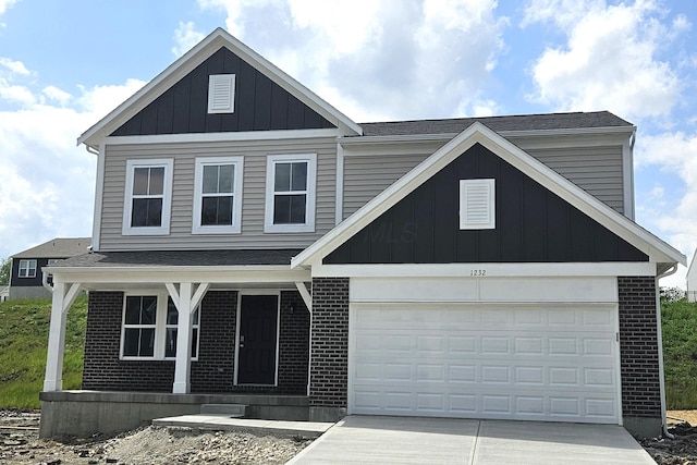 1232 Heathgate Way, Fairborn, OH 45324 - view of front facade with board and batten siding, a porch, concrete driveway, brick siding, and a shingled roof