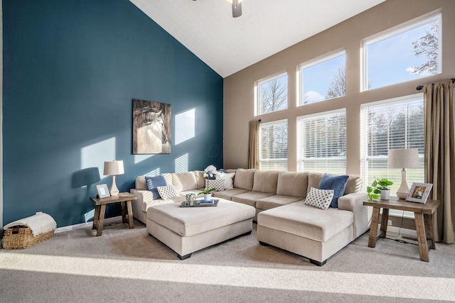 living room featuring high vaulted ceiling and carpet