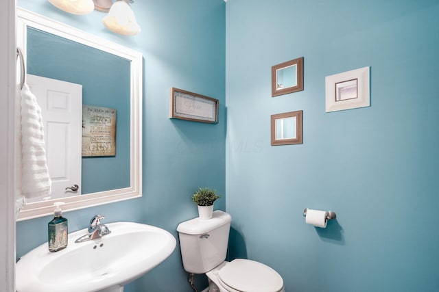 bathroom with sink and toilet