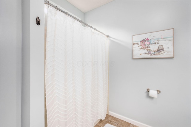 bathroom with tile patterned flooring