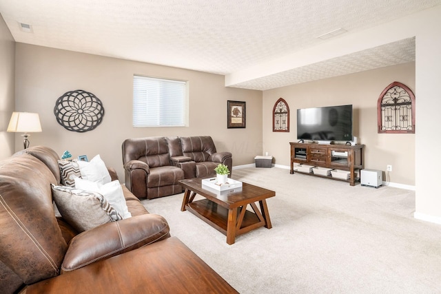 living room with light colored carpet and a textured ceiling