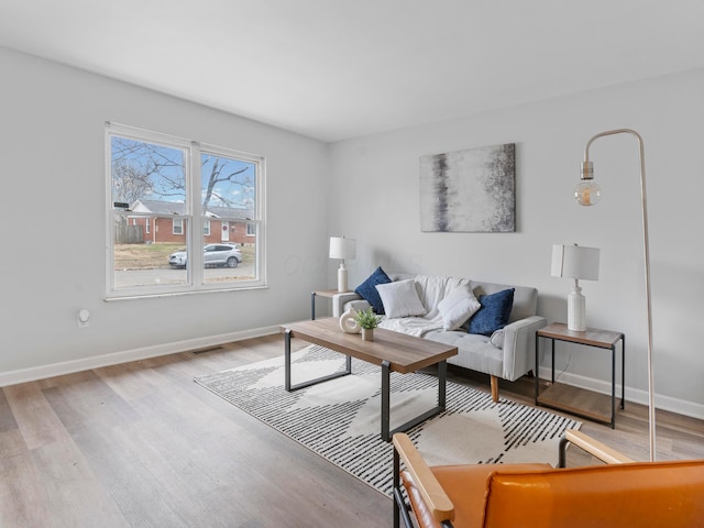 living room with light hardwood / wood-style floors