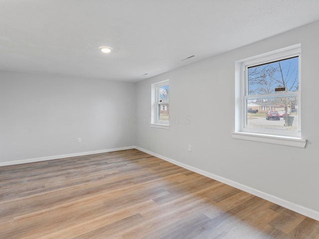 empty room featuring light hardwood / wood-style floors