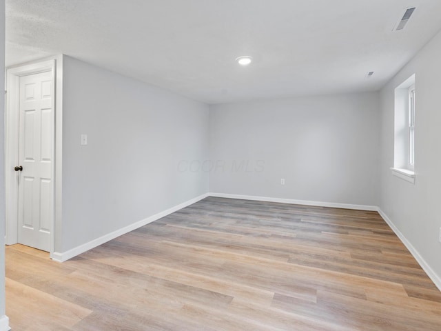 unfurnished room featuring light hardwood / wood-style flooring