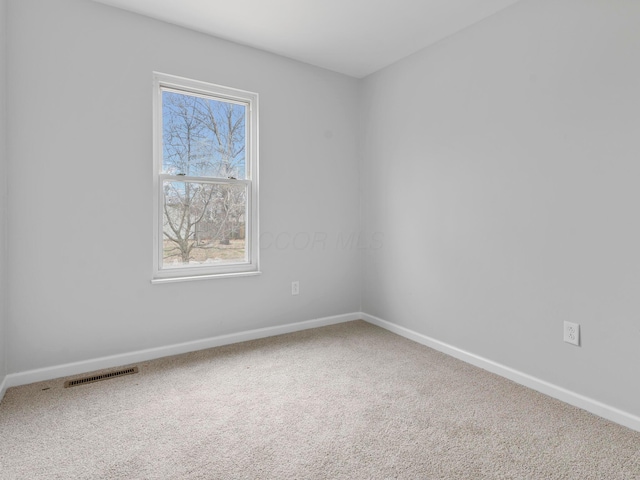 unfurnished room with carpet flooring