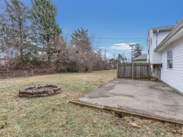 view of yard with a fire pit and a patio area