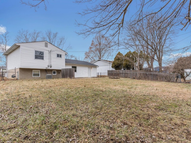 rear view of house featuring a lawn