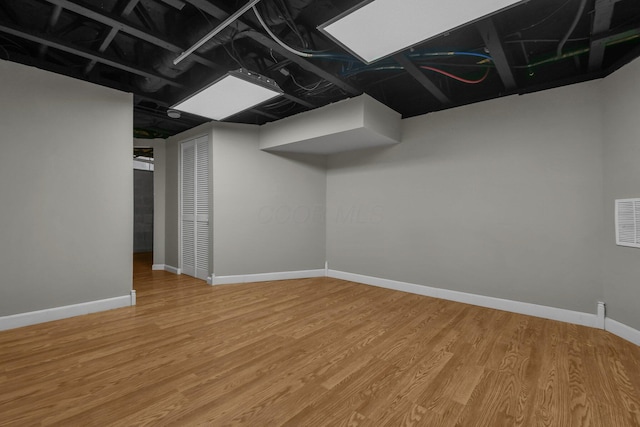 basement with wood-type flooring