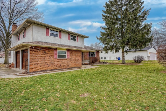 view of front of home featuring a garage and a front lawn