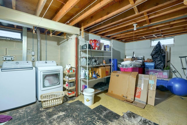 basement with washer and clothes dryer