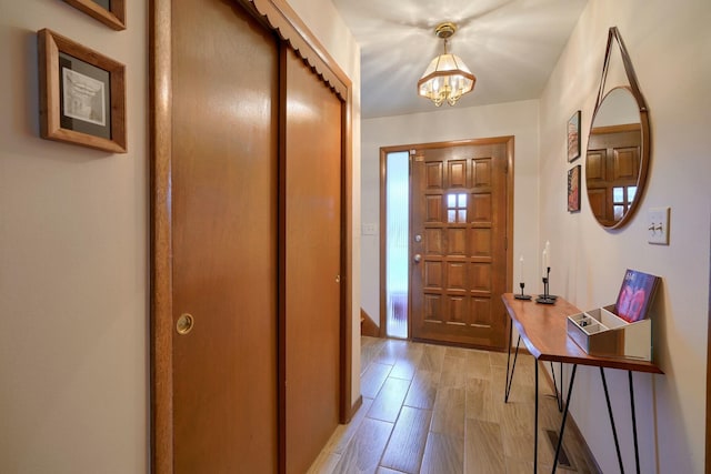 interior space featuring a chandelier and light wood-type flooring