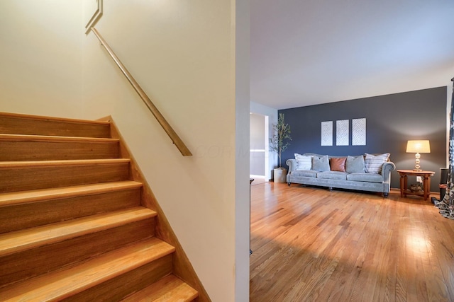 stairway featuring hardwood / wood-style flooring