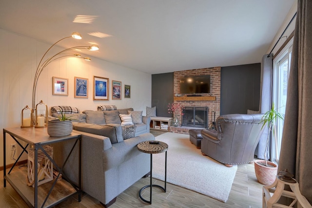 living room with a fireplace and light hardwood / wood-style floors