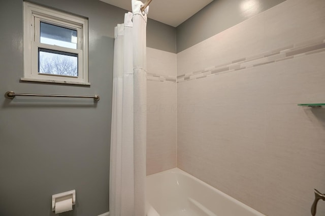 bathroom featuring shower / bathtub combination with curtain