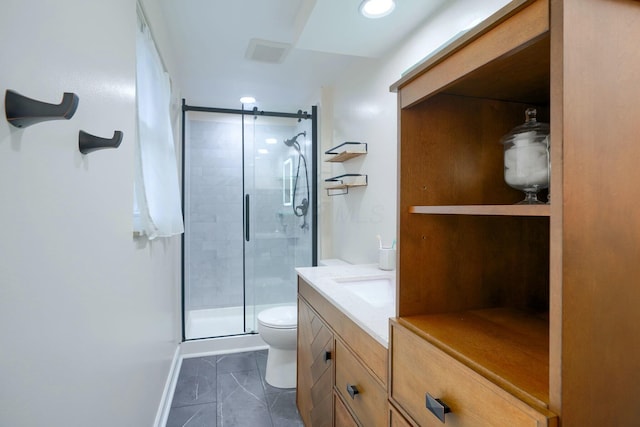 bathroom featuring tile patterned flooring, vanity, an enclosed shower, and toilet