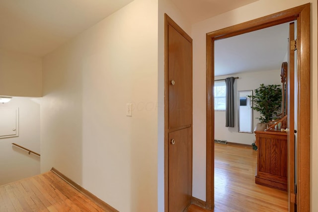 hallway with light hardwood / wood-style flooring